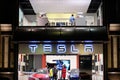 TESLA car store and customers inside