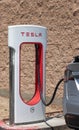 Tesla Charging station close-up with Tesla attached Royalty Free Stock Photo