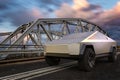 Tesla Cybertruck in front of a truss bridge during an evening storm Royalty Free Stock Photo