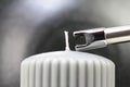 Tesla lighter ignites candle wick Royalty Free Stock Photo