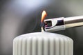 Tesla lighter ignites candle wick Royalty Free Stock Photo