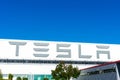 Tesla logo displayed on the exterior wall of Tesla Factory, automobile manufacturing plant in Silicon Valley
