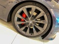 A Tesla Model S wheel at a Tesla retail store