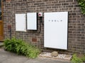 Tesla Powerwall 2 and Backup Gateway 2 on a house wall