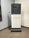 The Tesla Powerwall and Sign at the entrance of the Tesla dealership in Orlando, FL