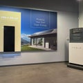 The Tesla Powerwall and Solar Sign at the entrance of the Tesla dealership in Orlando, FL