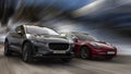 Tesla is a red car and Jaguar is a black car. Royalty Free Stock Photo
