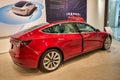 Red Model 3 on display at Tesla showroom Royalty Free Stock Photo