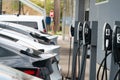 Tesla vehicles charging in a row