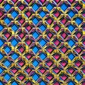 Tessellating Tiles: An image of a geometric pattern created with tessellating shapes, in a mix of contrasting colors and bold de