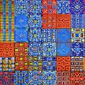 Tessellating Tiles: An image of a geometric pattern created with tessellating shapes, in a mix of contrasting colors and bold de