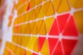 tessellation of a plane with yellow, orange and red colored triangles on a white background. mathematical and artistic game to co