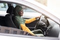 Test Drive. Black Muslim Lady Driving Car In City, Checking New Auto Royalty Free Stock Photo