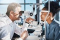 Test, eye exam or black woman consulting doctor for eyesight at optometrist or ophthalmologist. African customer testing Royalty Free Stock Photo