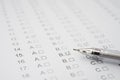 Test score sheet with answers and ballpoint Royalty Free Stock Photo