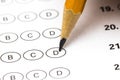 Test score sheet with answers and pencil . Closeup Royalty Free Stock Photo