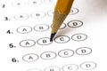 Test score sheet with answers and pencil . Closeup Royalty Free Stock Photo