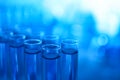 Test tubes with blue liquid on blurred background. Laboratory analysis Royalty Free Stock Photo