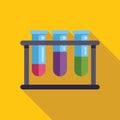 Test tubes with colored liquid in a support are standing on yellow background Royalty Free Stock Photo