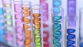 Test tubes with different illustrations of DNA in laboratory, closeup Royalty Free Stock Photo