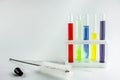 Test tubes with multi-colored reagents on a white background. chemistry Royalty Free Stock Photo