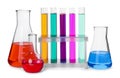 Test tubes and other laboratory glassware with colorful liquids on white background Royalty Free Stock Photo