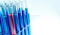 Test tubes with red or blue liquid in a holder. Testing laboratory, chemical testing facility, medical testing Royalty Free Stock Photo