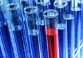 Test tubes with red or blue liquid in a holder. Testing laboratory, chemical testing facility, medical testing Royalty Free Stock Photo