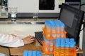 Engineer ecologist analyzes the computer. Test tubes with samples of soil, water and air in a real environmental laboratory. Royalty Free Stock Photo