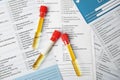 Test tubes with urine samples for analysis on laboratory test form Royalty Free Stock Photo