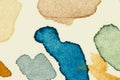 Test watercolor vibrant paint spots on thick aquarelle paper sheet, left as group of small drops and splash marks Royalty Free Stock Photo