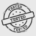 Tested rubber stamp isolated on white background.