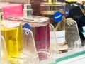 Tester bottles of assorted fragrances on display in store shelf Royalty Free Stock Photo