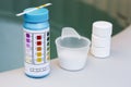 tester with tablet and powder of chlorine or bromide for mainteance of water quality of jacuzzi or spa Royalty Free Stock Photo