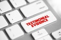 Testimonial Evidence is a statement made under oath, text concept button on keyboard