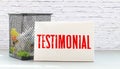 testimonials text concept write on notebook with pen Royalty Free Stock Photo