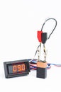 Testing battery with digital voltmeter Royalty Free Stock Photo
