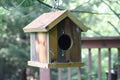 testing birdhouse sturdiness by hanging it outdoors Royalty Free Stock Photo