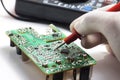 Testing SMD component using multitester Royalty Free Stock Photo