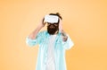 Testing software. Bearded man yellow background vr glasses. Large selection of compatible apps. Vr concept. Buy vr Royalty Free Stock Photo