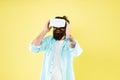 Testing software. Bearded man yellow background vr glasses. Large selection of compatible apps. Vr concept. Buy vr Royalty Free Stock Photo