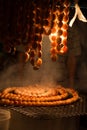 A testy Thai sausage grilling on stove.