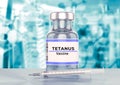 Tetanus vaccine ampoule and syringe on a stainless steel laboratory table Royalty Free Stock Photo