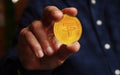 Tether cryptocurrency symbol golden coin in hand