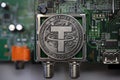 Tether USDT cryptocurrency physical coin placed on computer micro sheme with ports