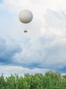 Tethered aerostat balloon.