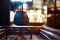 Tetsubin Cast Iron Kettle Suspended Over an Irori Hearth in a traditional Japanese style Farm House Heated over Charcoal Royalty Free Stock Photo