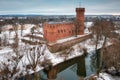 Teutonic Castle at the Wda river in winter scenery. Swiecie, Poland