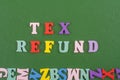 TEX REFUND word on green background composed from colorful abc alphabet block wooden letters, copy space for ad text. Learning Royalty Free Stock Photo