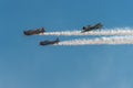AT-6 Texan Trio With Smoke and Blue Sky